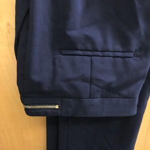 Navy dress pants with gold zipper detail